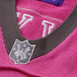 Close-up of the collar with an embroidered WA logo shield in charcoal.