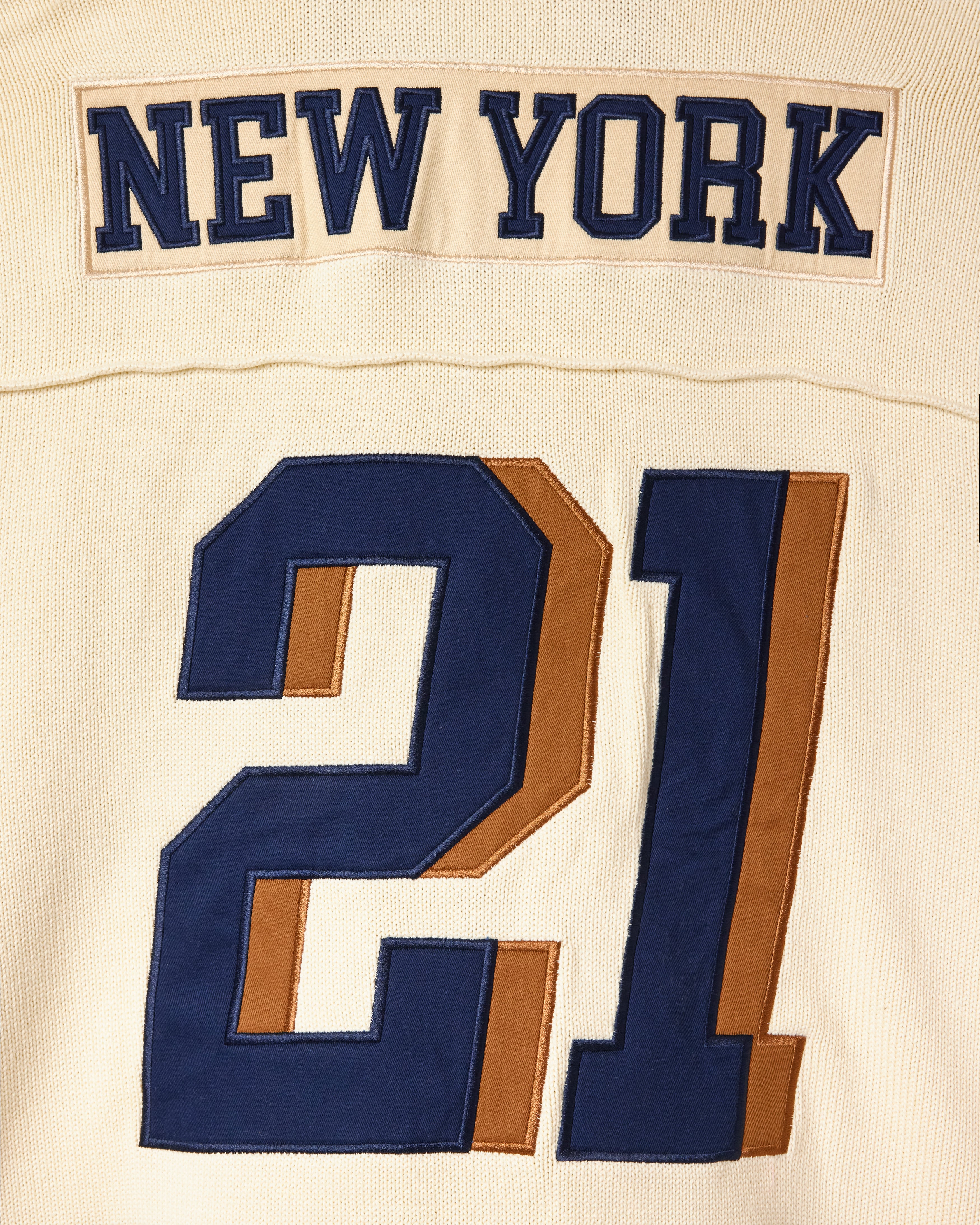Wisdom Of Age football sports jersey with 'New York' and number '21' on a cream background