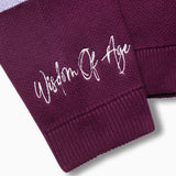 Right sleeve with the brand name "Wisdom of Age" written near the cuff end in a handwritten script cursive