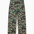 Camouflage pants with a WA logo on a white background