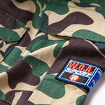 Camouflage fabric with the W.O.A patch on a white background
