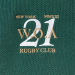 Embroidered WOA logo on a green fabric with text 'New York Rugby Club W.O.A 21'.