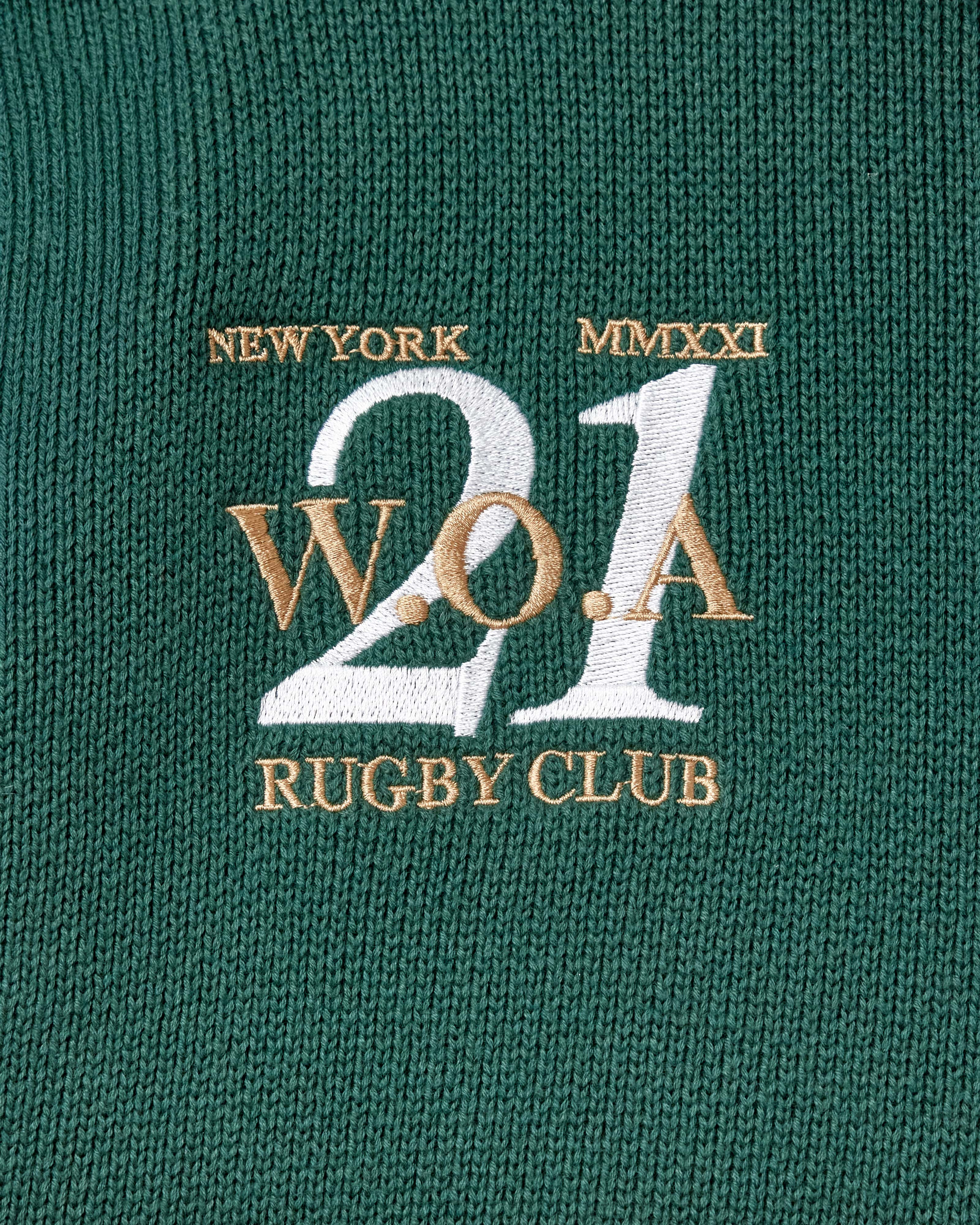 Embroidered WOA logo on a green fabric with text 'New York Rugby Club W.O.A 21'.