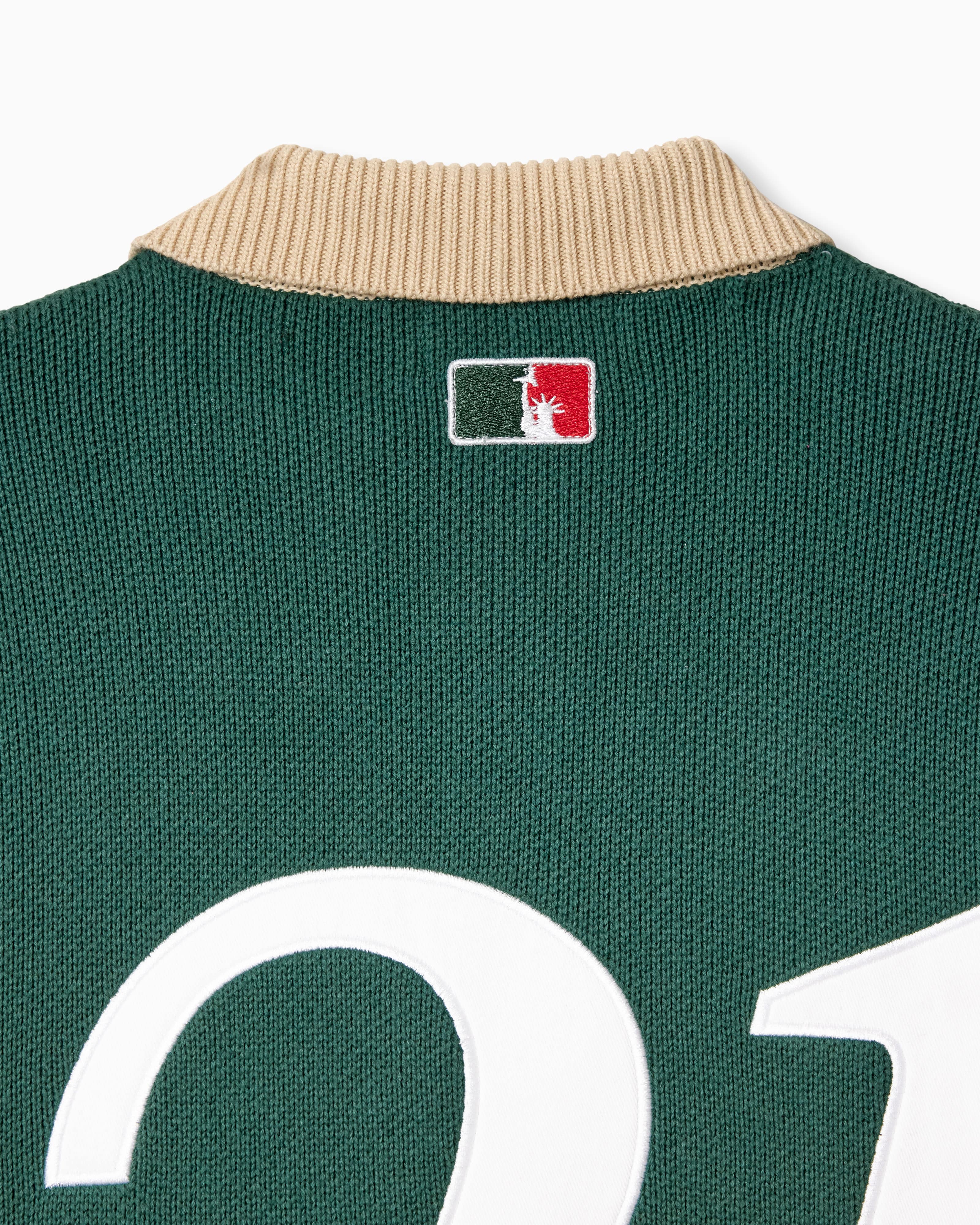 Bleecker Green rugby sweater with the WOA logo on the neck against a white background