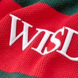 Red and green striped fabric with 'WISD' embroidered in white
