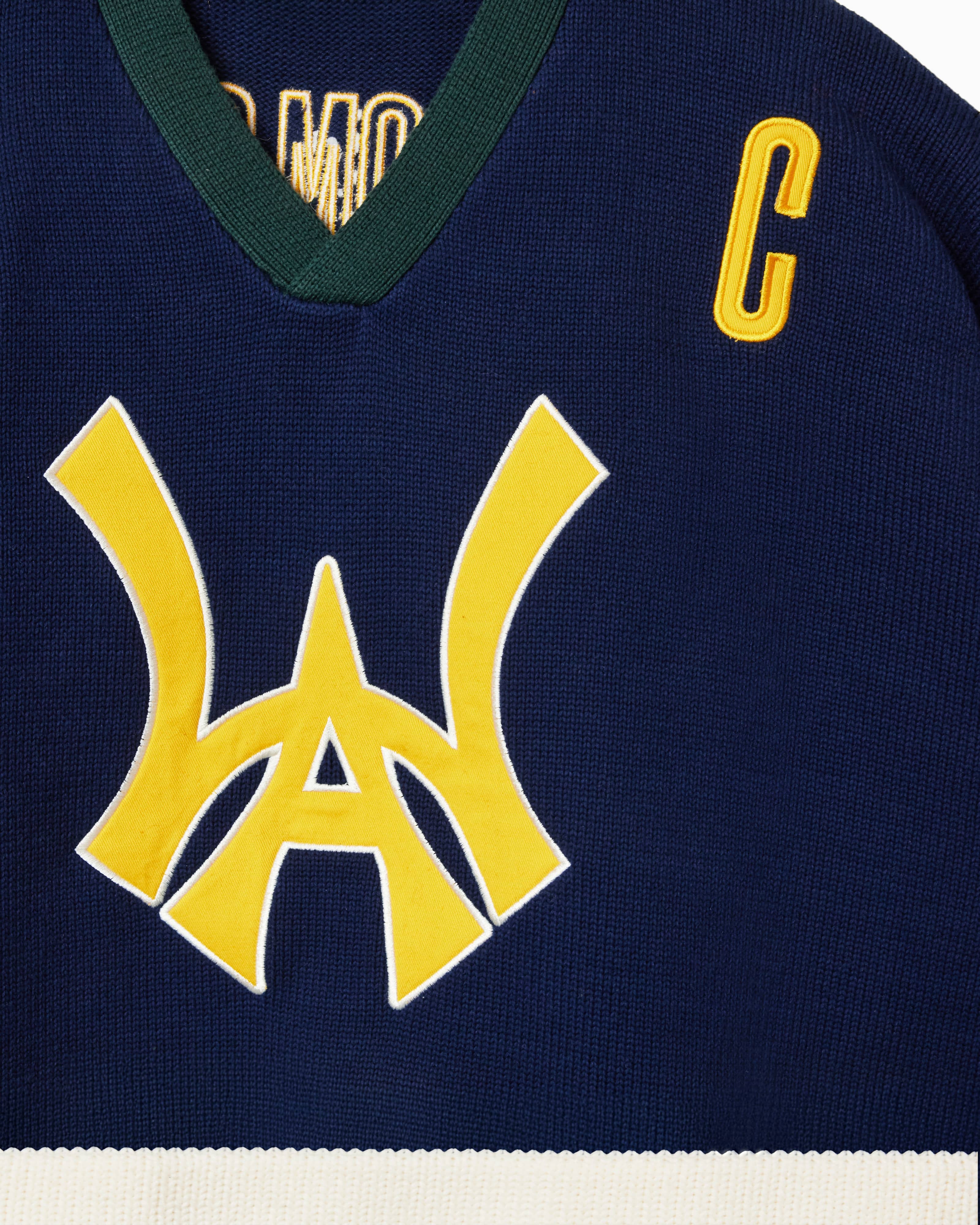 Close Up Of The Wisdom Of Age Knit Hockey Jersey Navy Front View