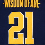 Close Up Of The Wisdom Of Age Knit Hockey Jersey Navy Rear View. Wisdom Of Age on the nameplate. The number 21 under.