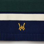 Close Up Of The Wisdom Of Age Knit Hockey Jersey Navy Bottom Front View.