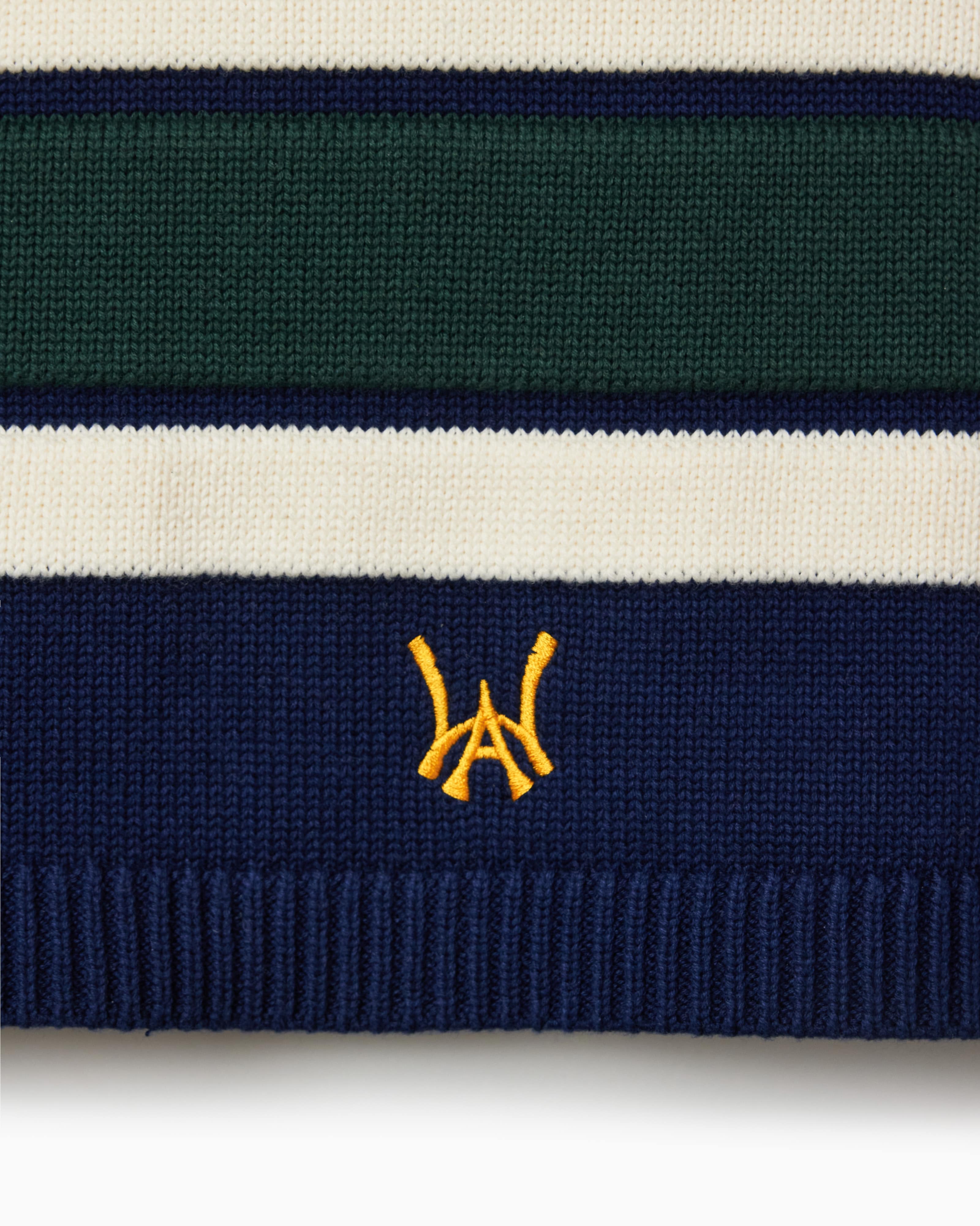Close Up Of The Wisdom Of Age Knit Hockey Jersey Navy Bottom Front View.