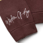 Right sleeve with the brand name "Wisdom of Age" written near the cuff end in a handwritten script cursive