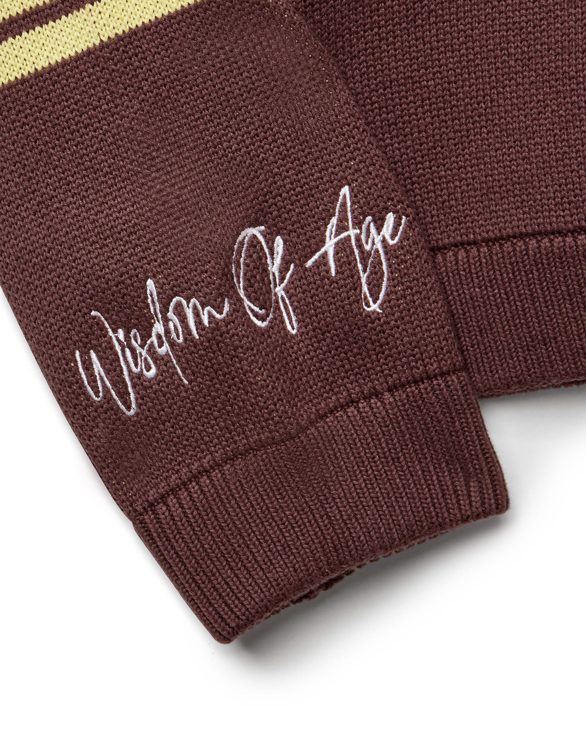 Right sleeve with the brand name "Wisdom of Age" written near the cuff end in a handwritten script cursive