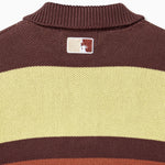 Closer look at the back of the sweater with an embroidered square patch below the nape of the neck and collar. The patch contains the upper half of the Statue of Liberty in a "NY Tough" inspired logo.