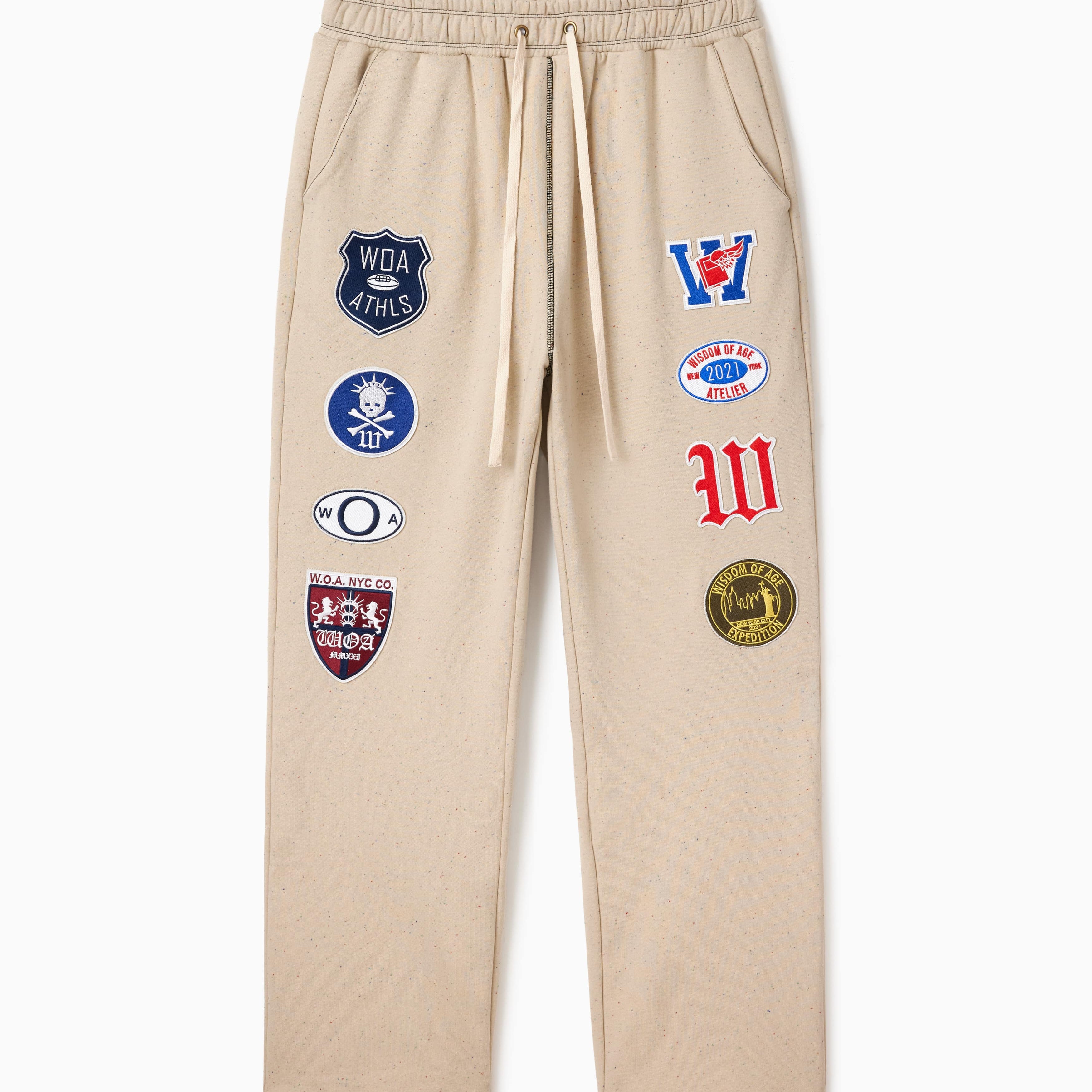 Wisdom Of Age Sandstone sweatpants with various Patches on a white background