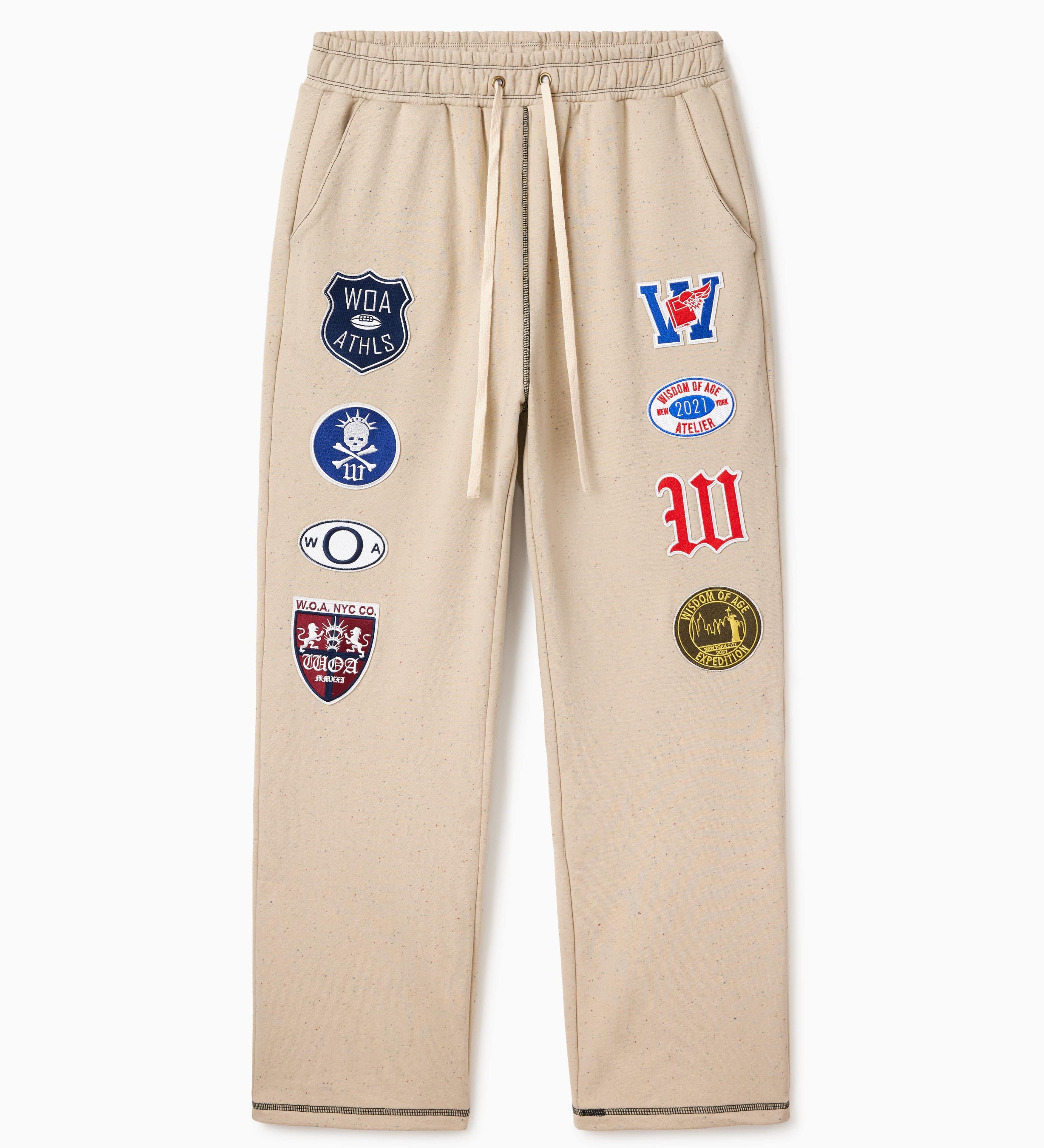 Wisdom Of Age Sandstone sweatpants with various Patches on a white background