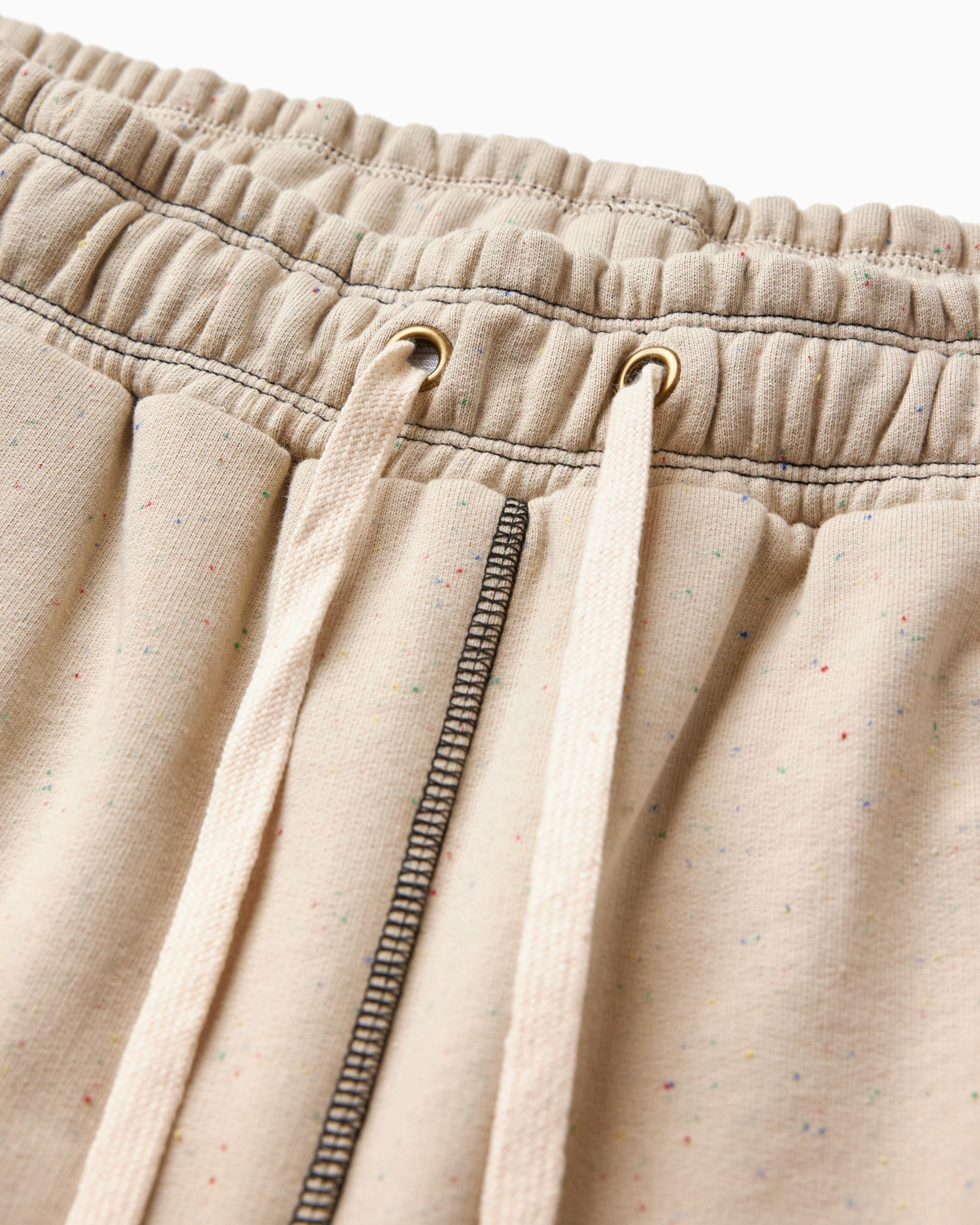 Close-up of Sandstone pants with a drawstring and zipper