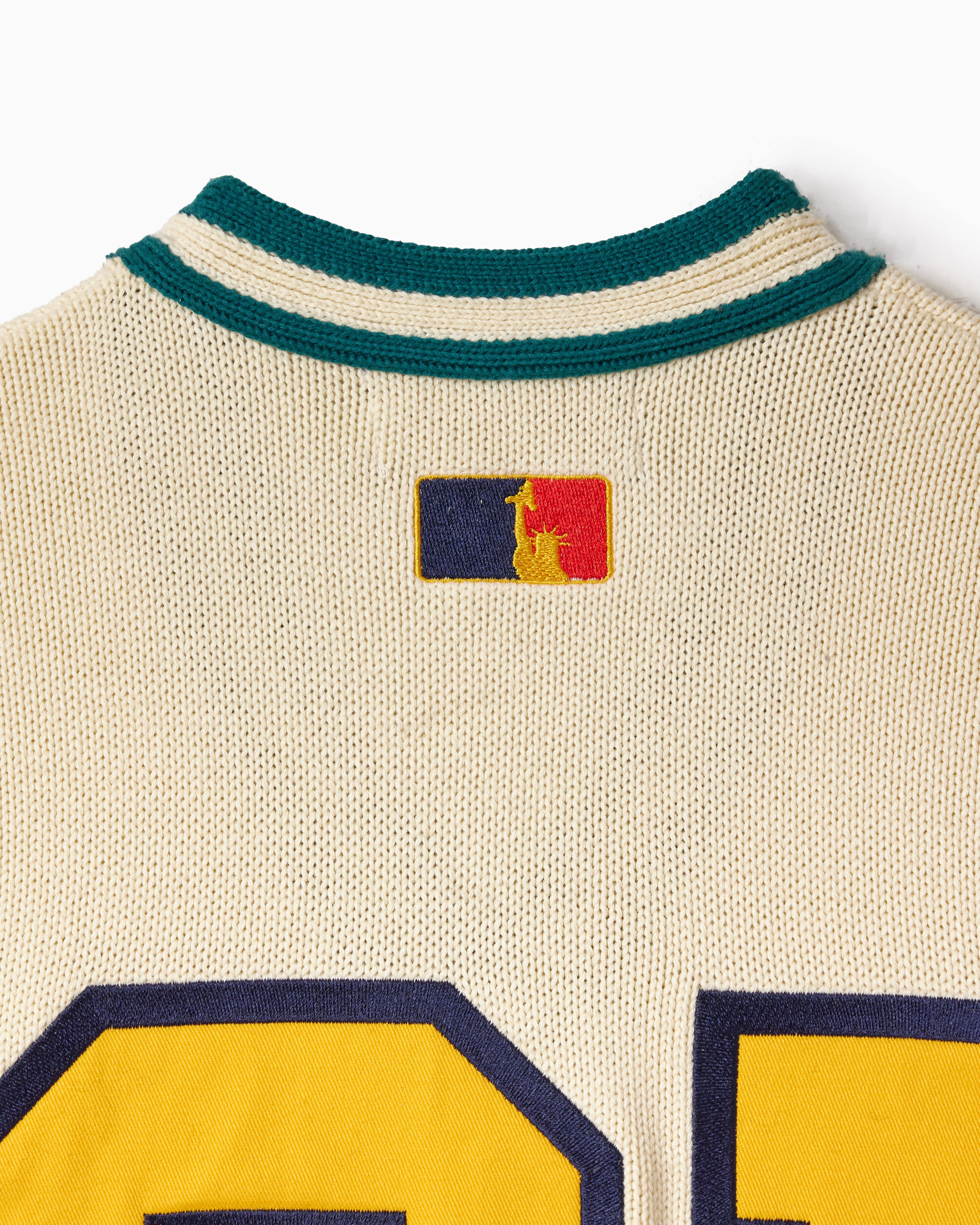 Close-up of a knitted jersey with the WOA Liberty logo
