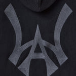 Closer look at the brand logo in a monogram font of connecting the "W" and "A" located on the middle back of the hoodie.
