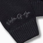 Closer look at the right sleeve with the brand name "Wisdom of Age" embroidered in a handwritten script cursive.