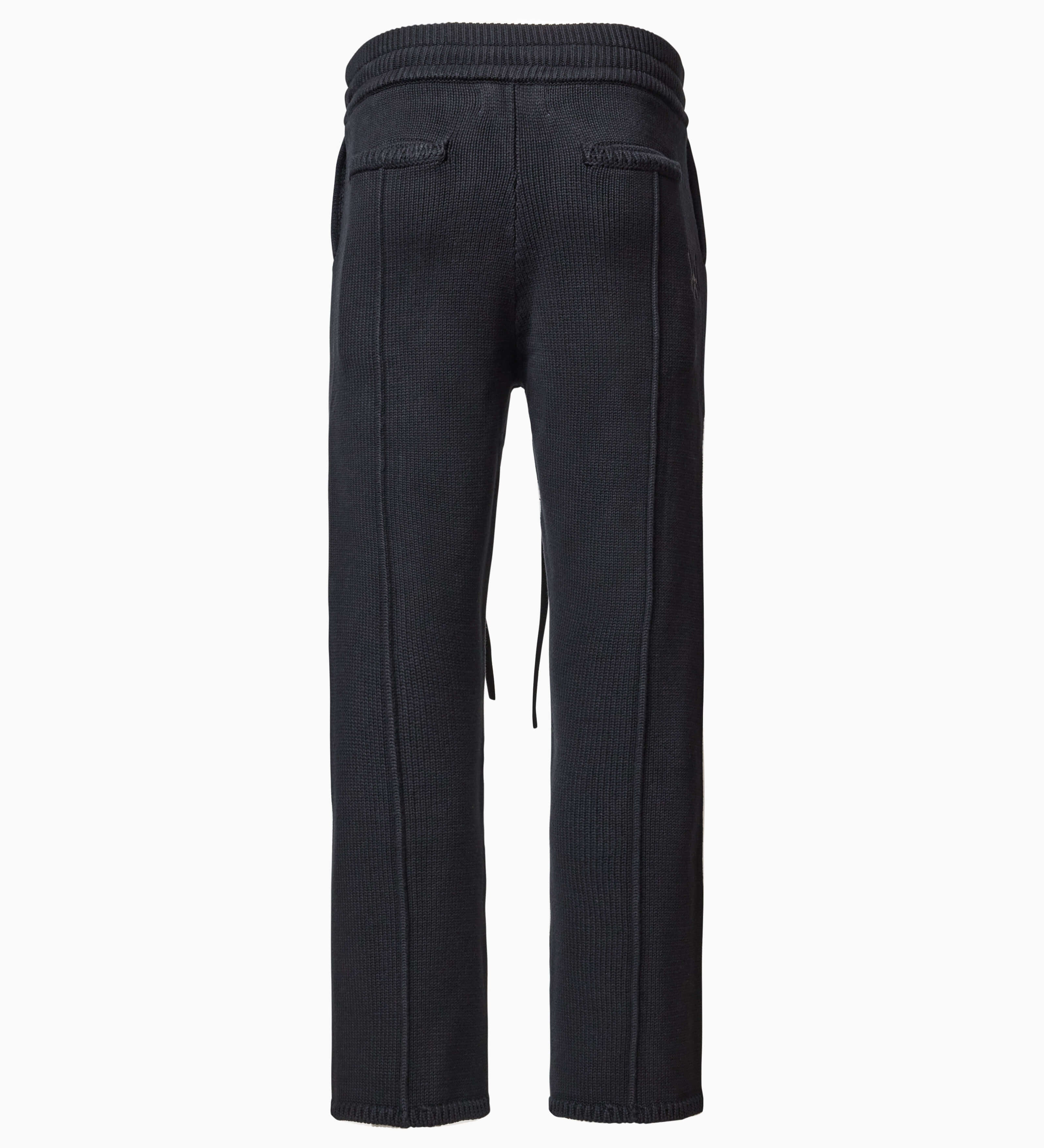 Back of Wisdom of Age Knit Sweatpants in Black. Back welt pockets and WA logo chain stitched below back right pocket on the side.