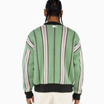Rear view Of a Male Model Wearing the Male model wearing the Wisdom Of Age City Cardigan in Sage Green with striped pattern and WA logo on a white background