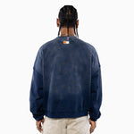 Male Model wearing a navy blue sweatshirt with the NY Tough logo on the back, standing against a white background