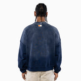 Male Model wearing a navy blue sweatshirt with the NY Tough logo on the back, standing against a white background