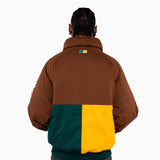 Male Model wearing a brown, green, and yellow jacket on a white background