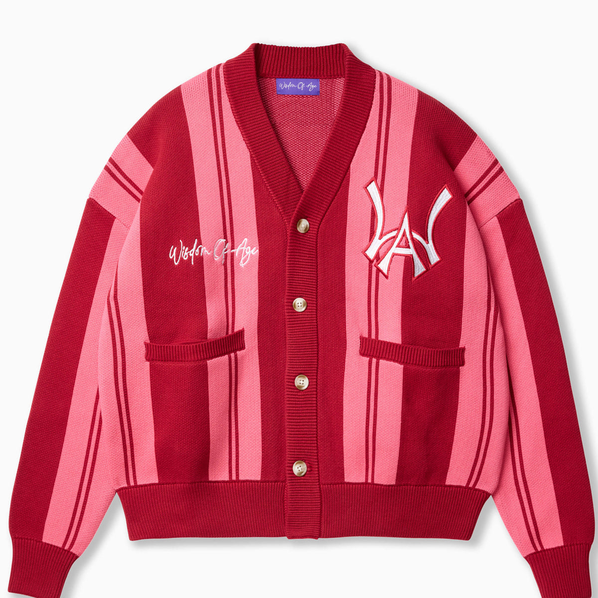 Wisdom of Age Raspberry Vertical Striped City Cardigan. Color blend of pink & red with the WOA symbol on the top left side of the chest and the brand name “Wisdom of Age” written in script cursive on the upper right side. Two drop-in slip pockets on both sides and a 4 button placket with a v-neck drop.