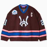 Front view of the Wisdom Of Age Knit Hockey Jersey with the WA logo on the center, the number 21 on both sleeves, a captains patch on the left chest and the wisdom of age patch on the right chest