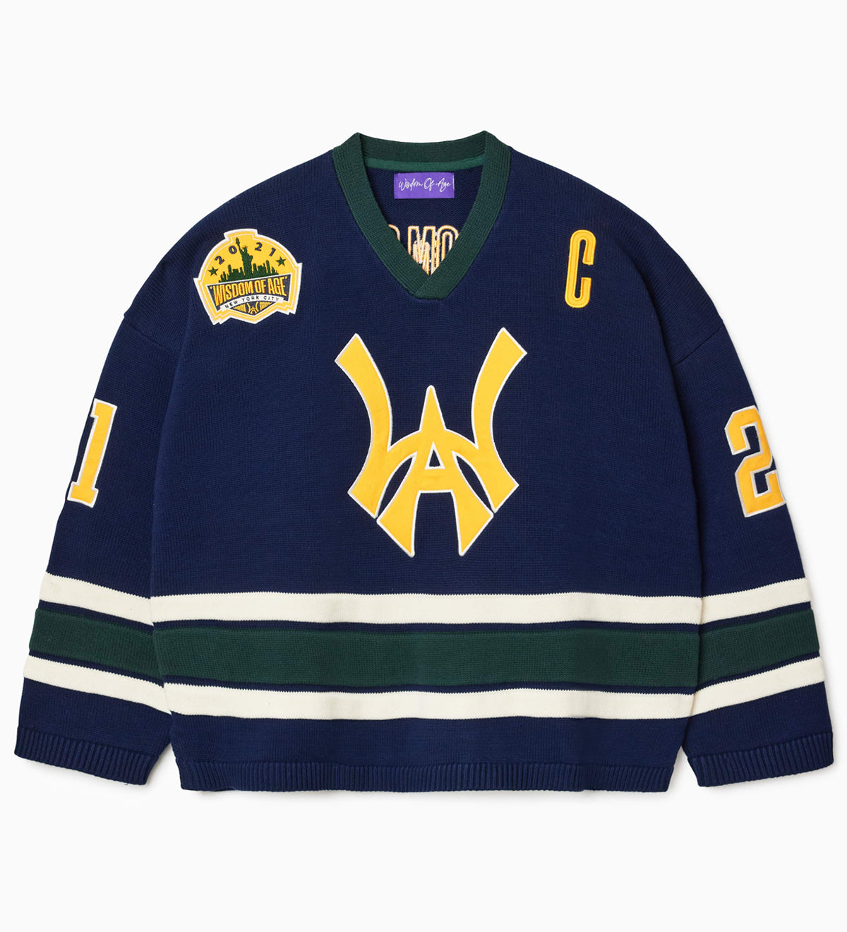Front view of the Wisdom Of Age Knit Hockey jersey Navy. WA logo on the front with and captains C on the left shoulder and a nyc skyline patch on the right shoulder. the number 21 on the sleeves
