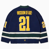 Rear view of the Wisdom Of Age Knit Hockey jersey Purple. Wisdom Of Age on the name plate with the number 21 underneath