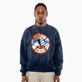 Male Model wearing a navy blue sweatshirt with a logo on a white background