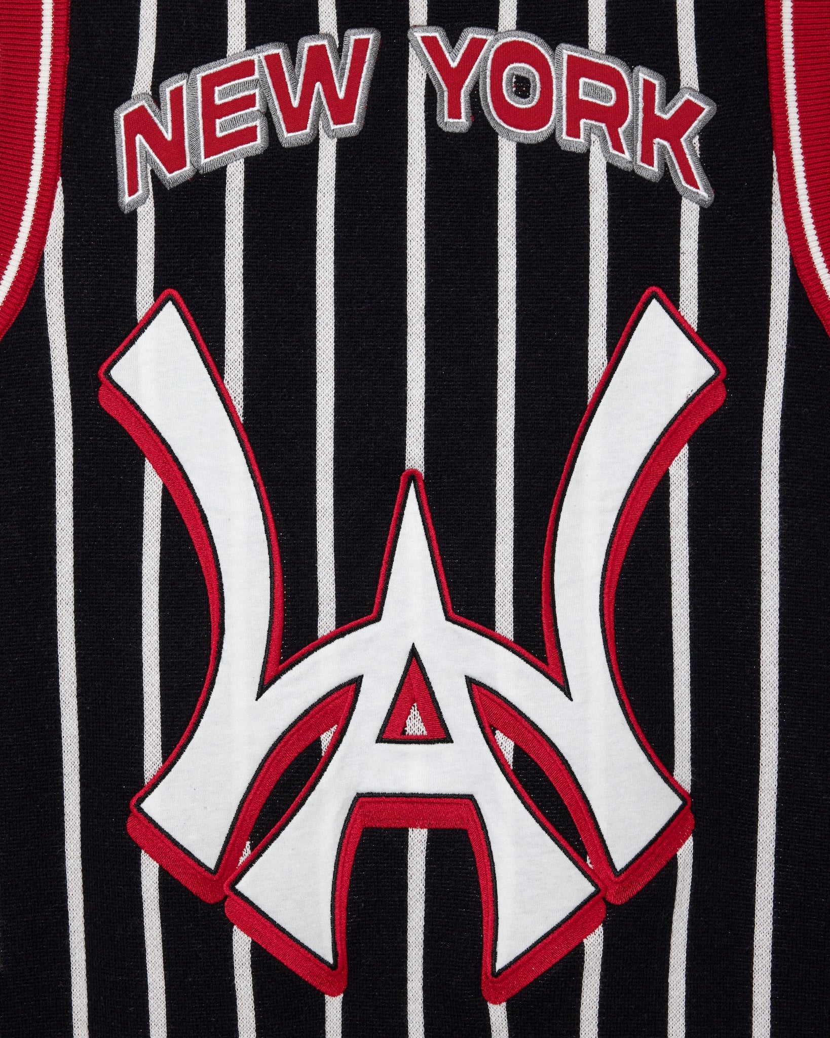 Wisdom Of Age Empire Basketball Jersey Black Pinstripe black close up view on New York lettering and brand logo